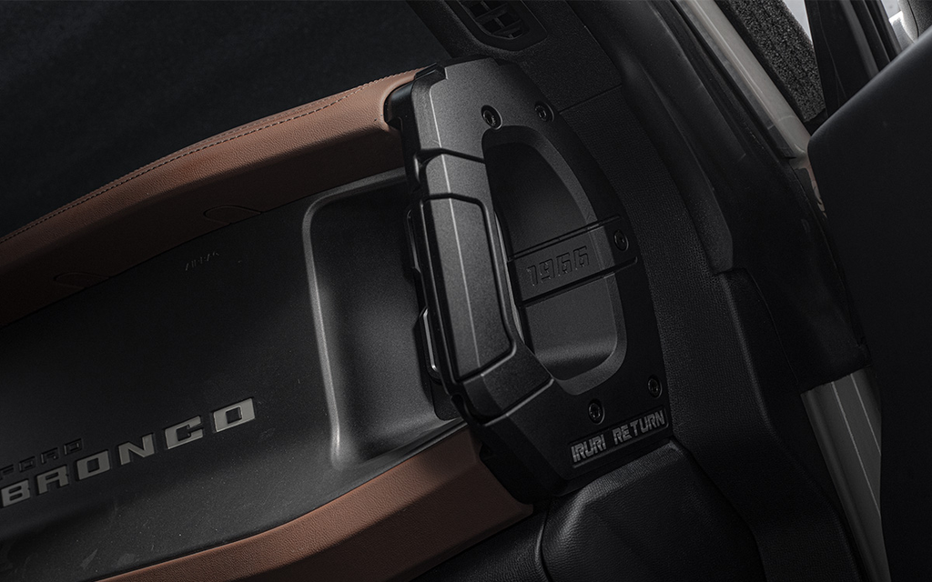 A pair of black, textured IRURI Center Console Side Grab Handles for the Ford Bronco, featuring the '1966' and 'IRURI RETURN' branding, displayed as an interior upgrade accessory.
