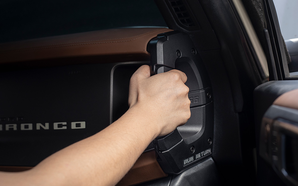 A pair of black, textured IRURI Center Console Side Grab Handles for the Ford Bronco, featuring the '1966' and 'IRURI RETURN' branding, displayed as an interior upgrade accessory.