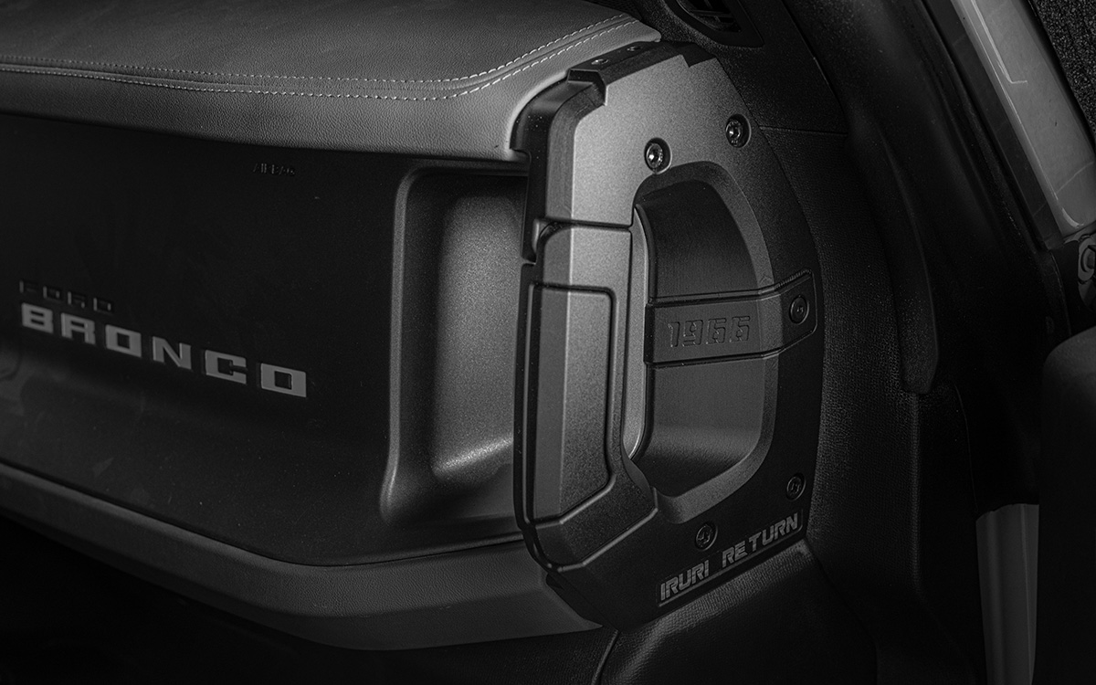 A pair of black, textured IRURI Center Console Side Grab Handles for the Ford Bronco, featuring the '1966' and 'IRURI RETURN' branding, displayed as an interior upgrade accessory.