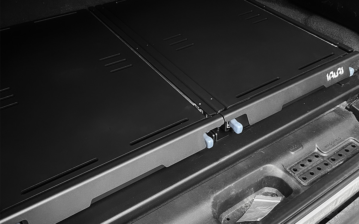 Studio isometric view of IRURI low-profile dual drawer storage platform closed and locked.