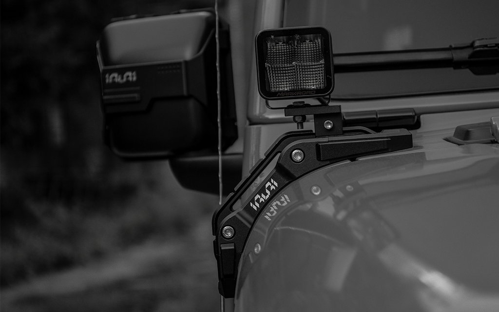 Upgrade night trails with the IRURI Origin A-Pillar Light Mount for Jeep JL & 4xe. No-drill install, CNC aluminum durability, and MIL-SPEC strength.