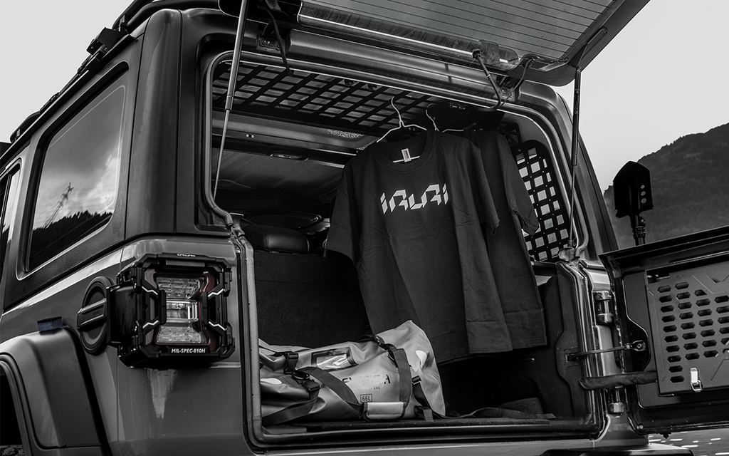 Upgrade your Jeep with the IRURI Rear Trunk Integrated Storage System. Military-grade organization and hydraulic shelves for ultimate space.