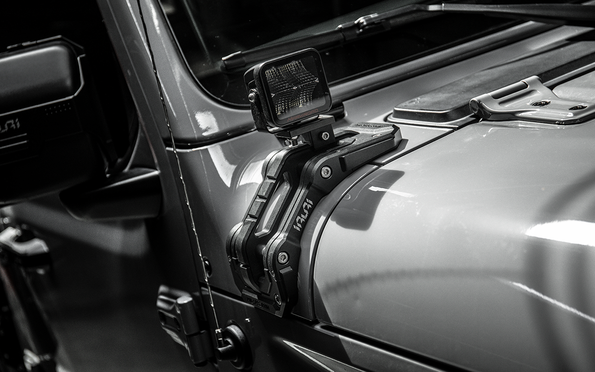 Upgrade night trails with the IRURI Origin A-Pillar Light Mount for Jeep JL & 4xe. No-drill install, CNC aluminum durability, and MIL-SPEC strength.