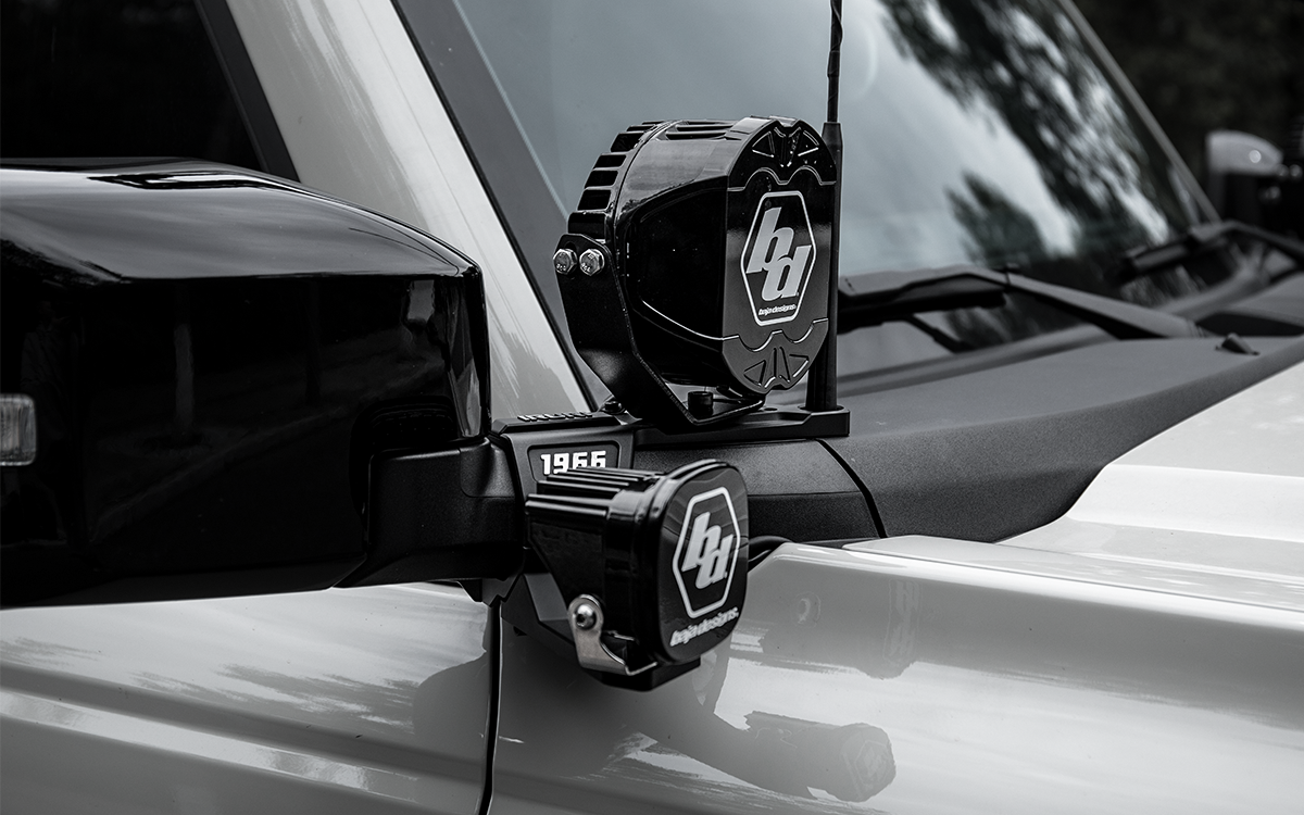 No-drill overland upgrade. 2021-2026 Ford Bronco A-pillar ditch light mounts. Heavy-duty brackets for LED pod lights. Wind-noise reducing tactical design.