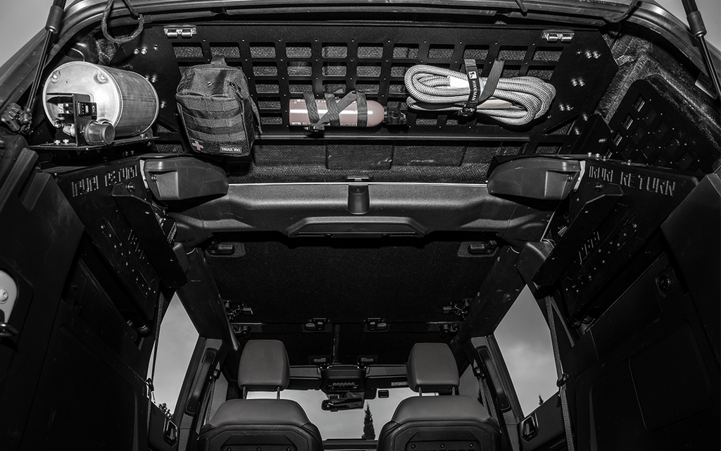 Maximize your storage. 2021-2026 Ford Bronco rear cargo tactical molle panel system. Heavy-duty steel design for mounting gear, first aid kits, and overland accessories. No-drill installation.