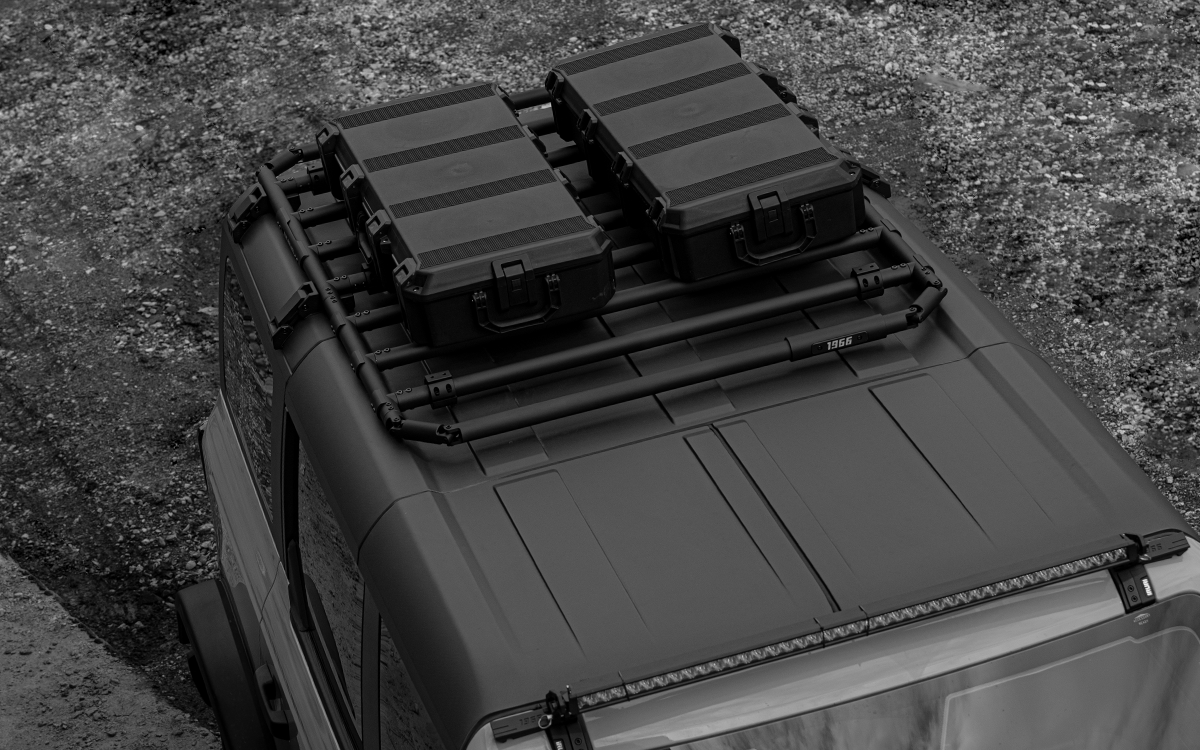 Premium 2021-2026 Ford Bronco roof rack platform. Low-profile aerodynamic design reduces wind noise. Modular no-drill cargo system for overland gear.