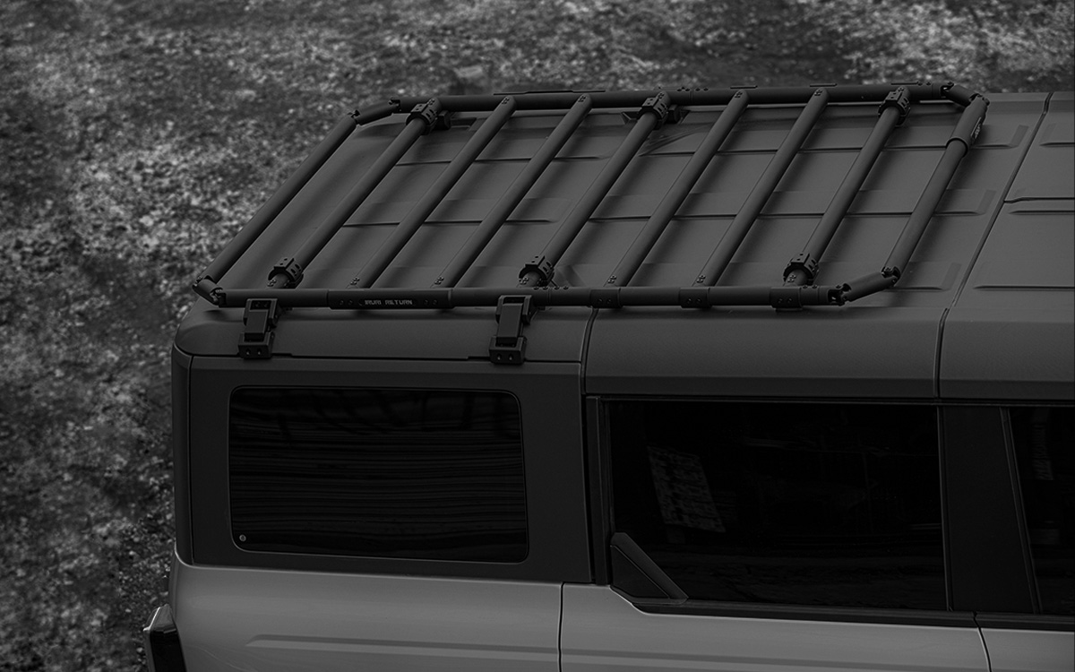 Premium 2021-2026 Ford Bronco roof rack platform. Low-profile aerodynamic design reduces wind noise. Modular no-drill cargo system for overland gear.