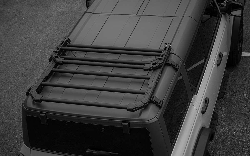 Ultimate overlanding utility. 2021-2026 Ford Bronco tactical folding roof rack platform. Heavy-duty design with noise-reducing folding mechanism. No-drill fit.