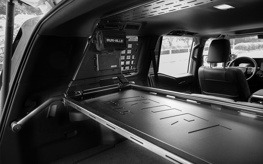 Upgrade your GX550 with the IRURI-HILLS Modular Cargo System. Steel build, removable field table, and MOLLE panels for a tactical trunk setup.